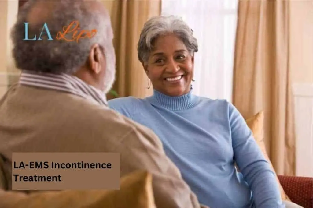 Couple sat smiling at each other - LA-EMS treatment Aylesbury